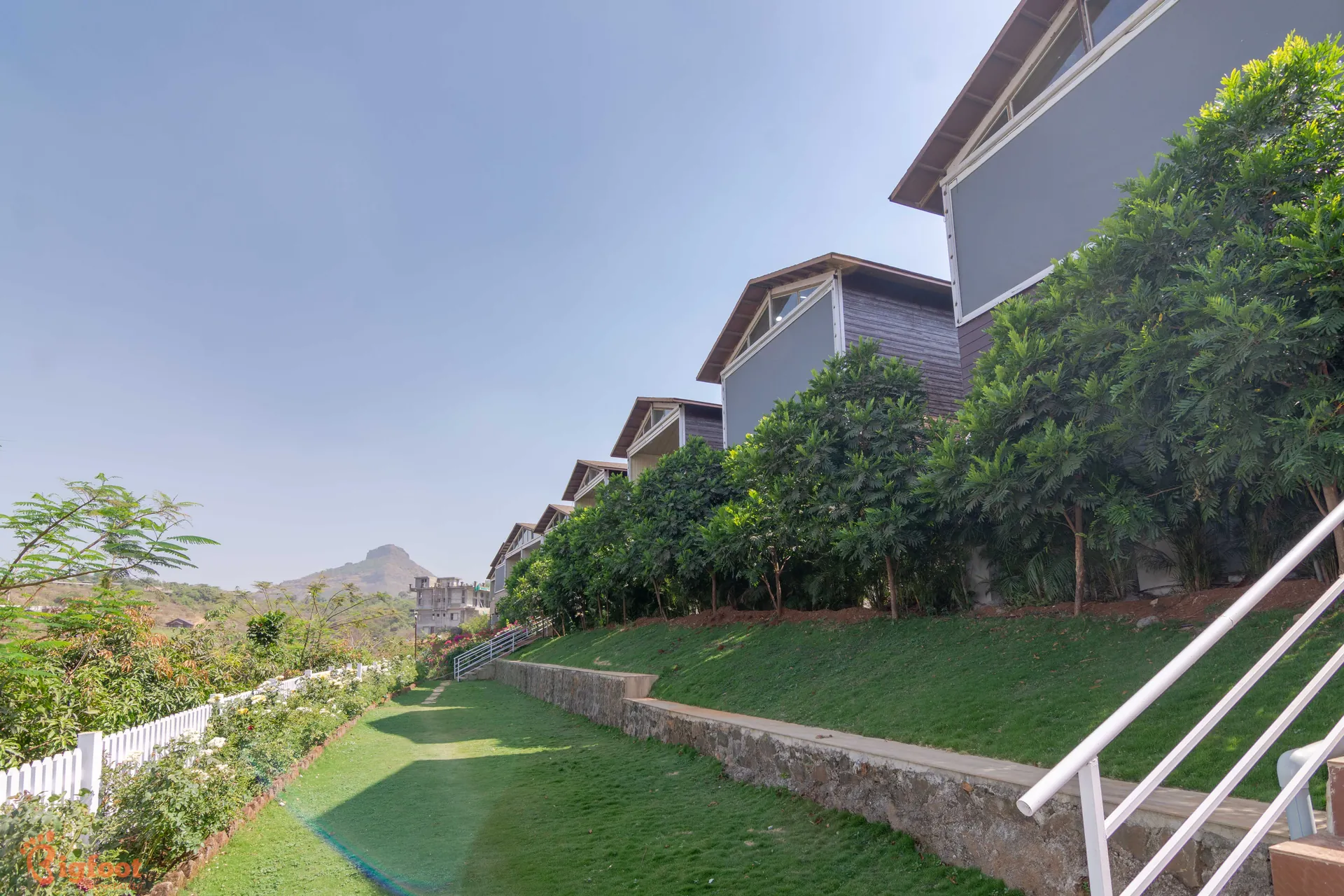 Aerial view of Azure Resort cottages overlooking the valley near Pawna Lake