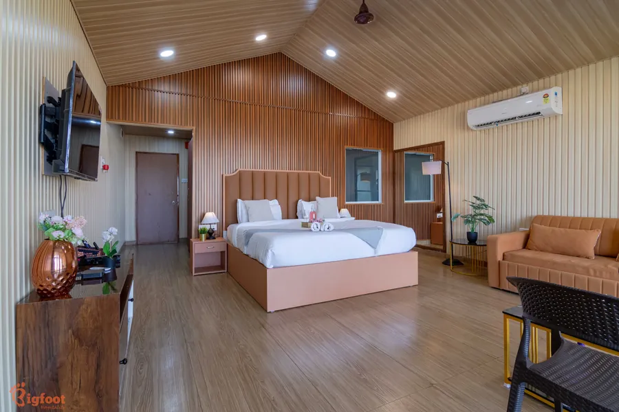 Vaulted-ceiling bedroom with warm wood interiors